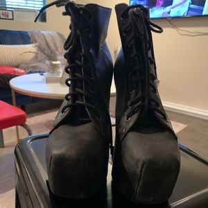 Jeffrey Campbell stomper shows with clear heel.